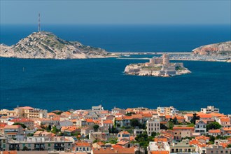 View of Marseille town and Chateau d'If castle famous historical fortress and prison on island in Marseille bay