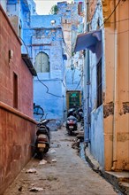 Bikes parked in indian streets of Jodphur also known as Blue City due to the vivid blue-painted Brahmin houses