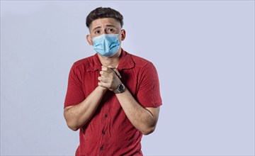 Latin man begging with medical protective face mask. pleading man concept isolated