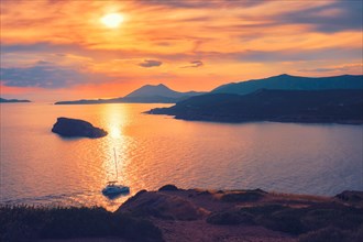Aegean Sea with Greek islands on sunset with yacht in sea
