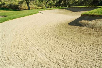 Abstract of golf course and sand bunker