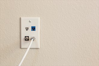 Multi-media wall plate with cable