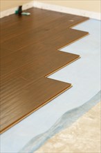 Newly installed brown laminate flooring abstract