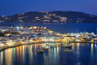 View of Mykonos Chora town Greek tourist holiday vacation destination with famous windmills