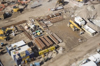 Aerial view of busy construction site with extreme bokeh