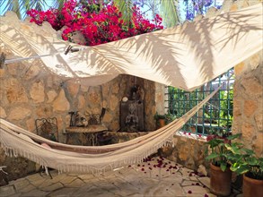 Romantic corner with hammock and awning