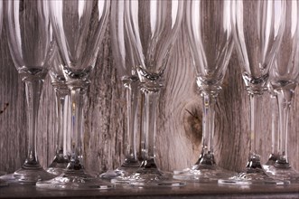 Champagne flutes on shelf abstract