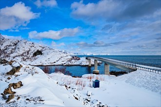 View of Djupfjord Bridge Djupfjordbrua over the fjord in winter