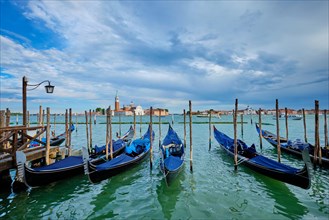 Gondolas in lagoon of Venice near Saint Mark