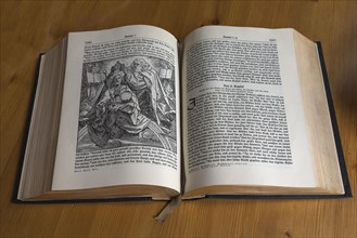 Opened old Bible with gilt edges