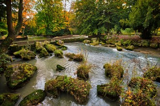 Munich English garden Englischer garten park and Eisbach river with artificial waterfall