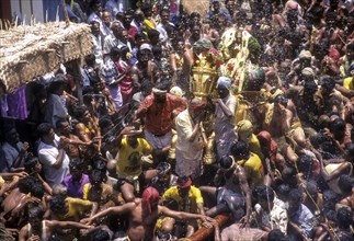 Ritual spraying of water on Lord Kallazhagar or Vishnu mounted on golden horse in Chitra or Chithirai festival in Madurai