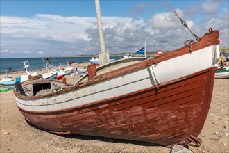 Weathered fishing boat at the natural harbour of Vorupoer