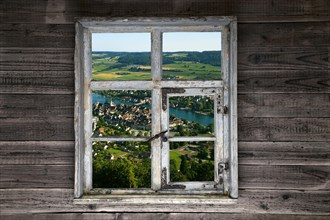 View through a rustic wooden window onto Stein am Rhein