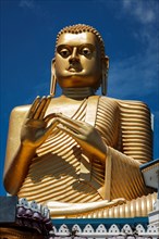 Gold Buddha statue on roof of Golden Temple