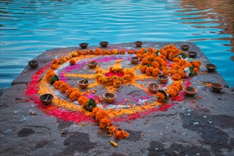 Oil Lamp Pooja Diya Lamp and flower garland on ghats after pooja in Jodhpur