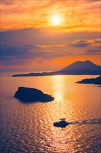 Aegean Sea with Greek islands on sunset with yacht in sea