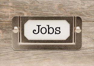 Jobs only metal file label frame on wood background