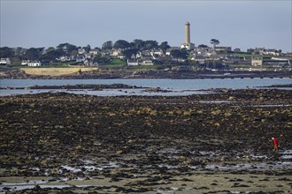 View at low tide from Roscoff to the island Ile de Batz with lighthouse