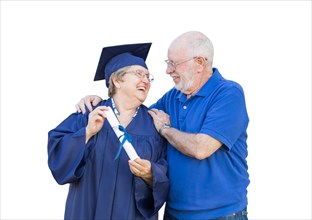 Senior woman and graduate in hat and gown being congratulated by husband isolated on white