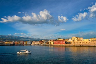 A fishing boat in the picturesque old harbor of Chania