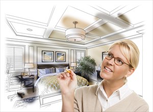 Creative woman with pencil over custom bedroom design drawing and photo combination