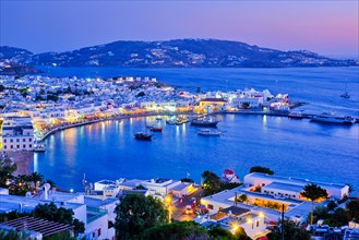 View of Mykonos Chora town Greek tourist holiday vacation destination with famous windmills