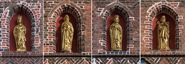 Vier vergoldete Heiligenskulpturen am Rathaus