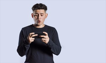 Man holding cell phone horizontally