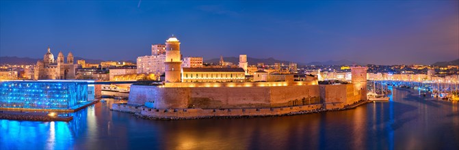 Marseille Old Port and Fort Saint-Jean and Museum of European and Mediterranean Civilisations and Marseille Cathedral illumintaed in night