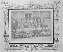 Faded class photo of a school class in 1890