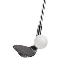 Black golf club wedge iron hitting golf ball on white background