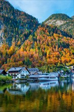 Austrian tourist destination Hallstatt village on Hallstatter See lake lake in Austrian alps with tourist boat