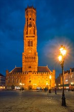Belfry tower famous tourist destination and Grote markt square in Bruges