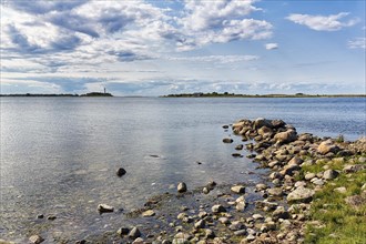 View of lagoon-like bay Grankullaviken with lighthouse Lange Erik on the horizon