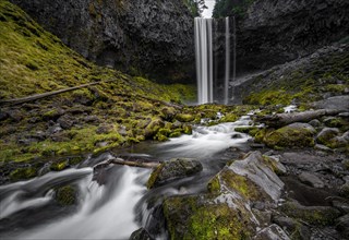 Waterfall cascading over rocky outcrop