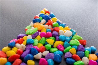 Pile of little colorful pebbles as stone background