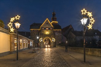 The historic Nuremberg Gate in Christmas lighting in the evening