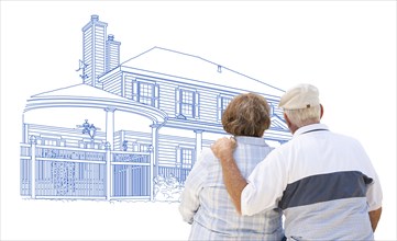 Curious embracing senior couple looking at house drawing on white