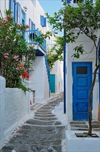 Picturesque scenic narrow streets with traditional whitewashed houses with blue doors windows of Mykonos Chora town in famous tourist attraction Mykonos island