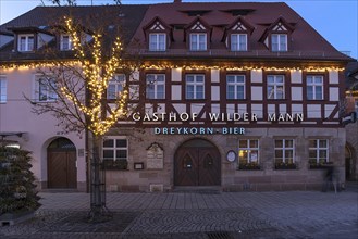 Historic inn since 1414 in the Christmas lights in the evening