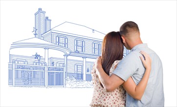 Embracing military couple looking at house drawing on white
