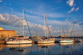 Yachts boats in picturesque old port of Chania is one of landmarks and tourist destinations of Crete island in the morning. Chania