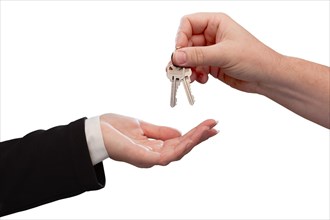 Agent handing over the keys to a new home isolated on white