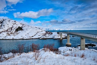 View of Djupfjord Bridge Djupfjordbrua over the fjord in winter. Moskenes