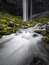 Waterfall cascading over rocky outcrop