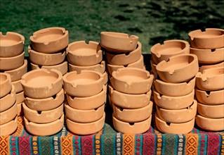 Set of brown ceramic ashtrays in view