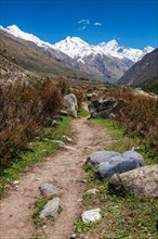 Old trade route in Himalaya surrounded with stones to Tibet from Chitkul village from Sangla Valley