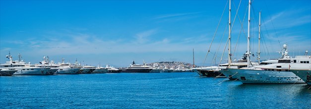Panorama of moored luxury Yachts and boats on summer day in port of Athens