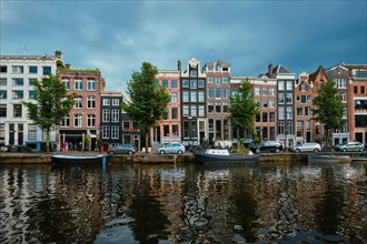 Singel canal in Amsterdam with old houses. Amsterdam